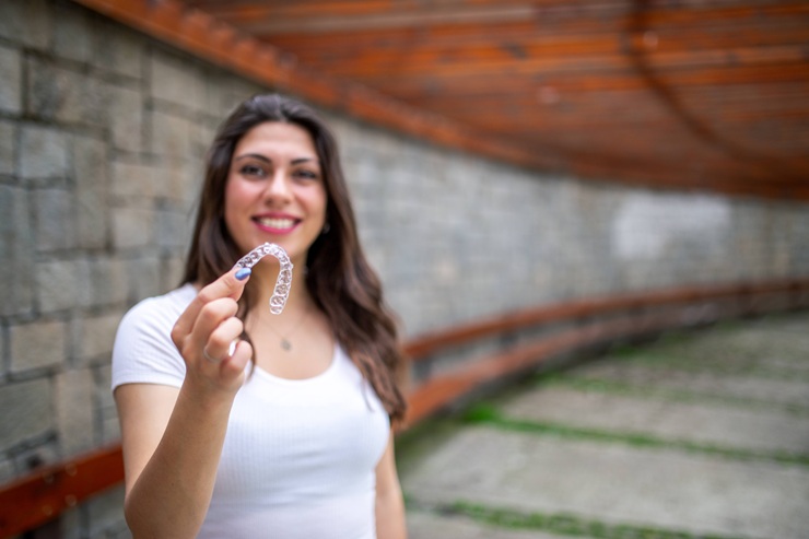Beautiful Smiling Woman with invisible teeth invisalign aligner