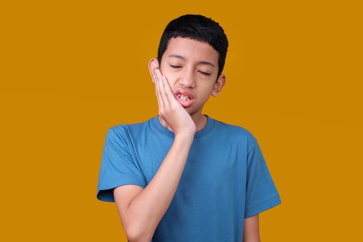 Little Boy Touching mouth for tooth pain